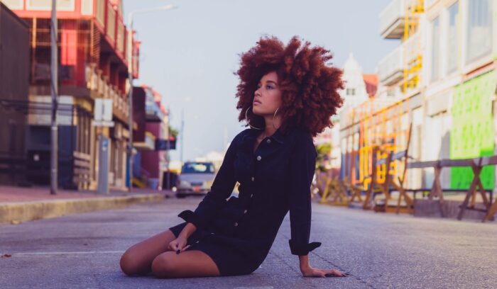 A woman with an afro|matthew t rader ar bPrLLrw unsplash