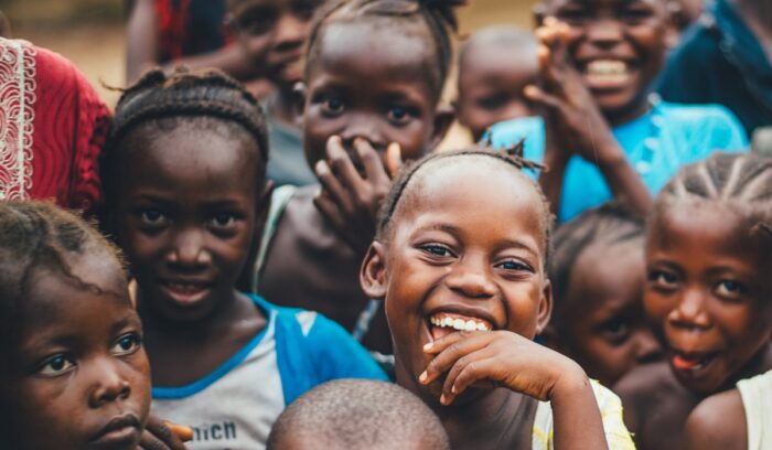 African children smiling, for article on malaria vaccine
