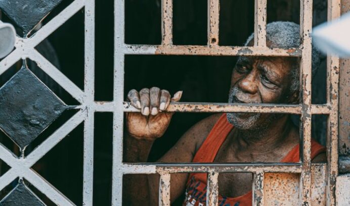 Black man behind bars