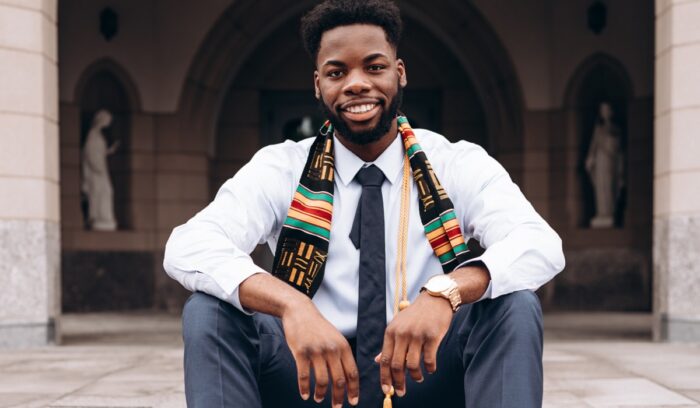 Black man sitting on steps