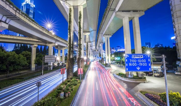 Blurred traffic lights, for article on China EV sales