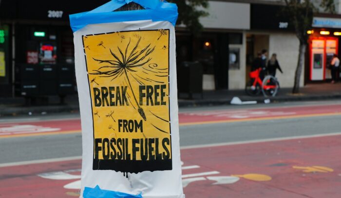 "Break free from fossil fuels" sign, for article on fossil fuel electricity