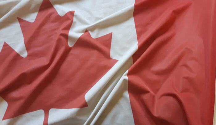 Canadian flag representing the country's high-speed internet basic service national standards