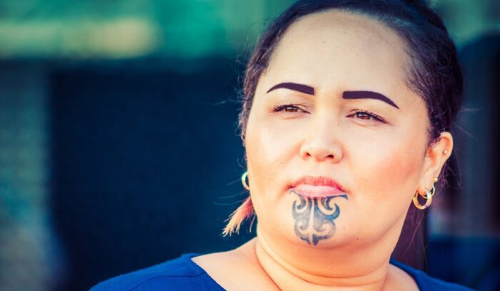 Close up portrait of a Maori business woman outdoors in the workplace., for article on Ngāti Maniapoto settlement