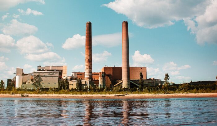 Cooling towers of a coal power plant at sunset for an article about coal phase-out