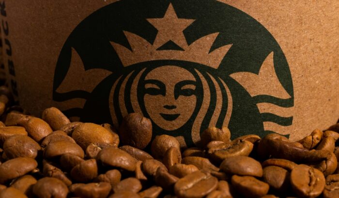 Coffee beans and Starbucks logo|charles koh unsplash|