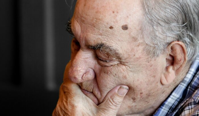 Elderly man in contemplation|vlad sargu unsplash