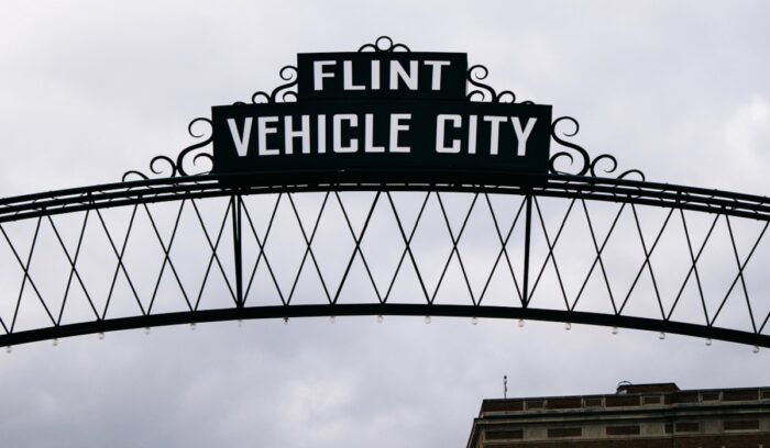 Flint Vehicle City sign representing the community impacted by flint water crisis funding efforts