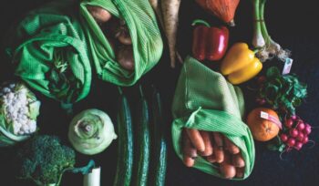 Abundant fresh produce at a market stall for an article about global food waste reduction