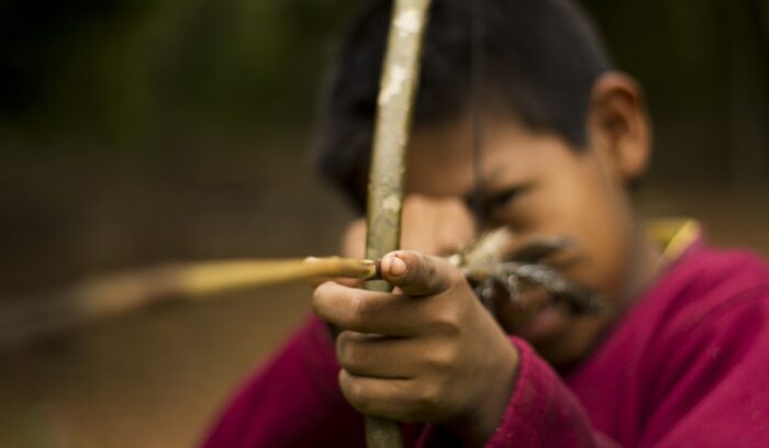 Guarani child holding bow, for article on Guaraní civilization