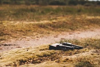 Gun lying on the ground highlighting the importance of a gun safety initiative