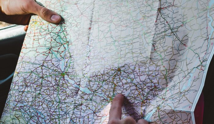 Hands holding map, for article on mammoth tusk map