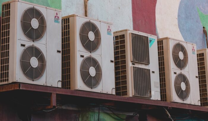A heat pump unit on a home exterior, representing U.S. heat pump sales growth supported by the Kigali Amendment