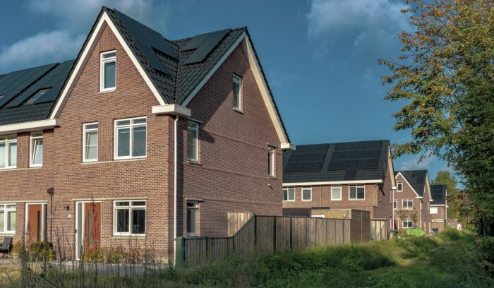 Houses with solar panels, for article on heat pump and solar installations