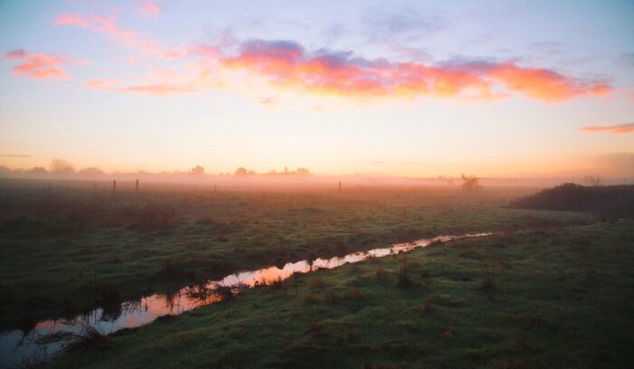 Irrigation canal at sunset, for article on early irrigation systems