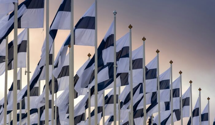 Many Finnish flags flying