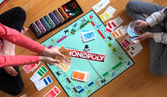 People playing Monopoly