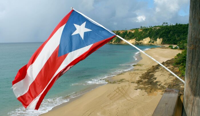 Puerto Rican flag at the beach|tatiana rodriguez unsplash