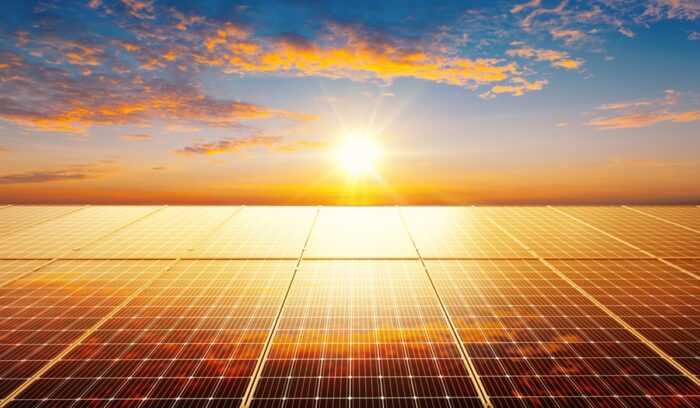 Solar panels installed on rooftops in an African village for an article about Africa solar imports, for article on gigawatt-scale solar farm
