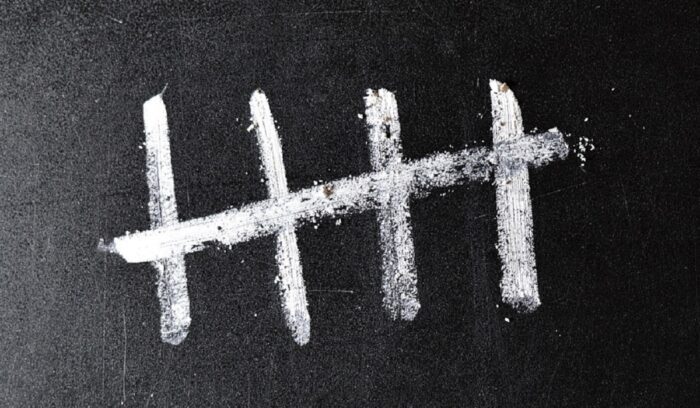 Close-up of notched prehistoric bone artifact for an article about tally marks Africa numeral system