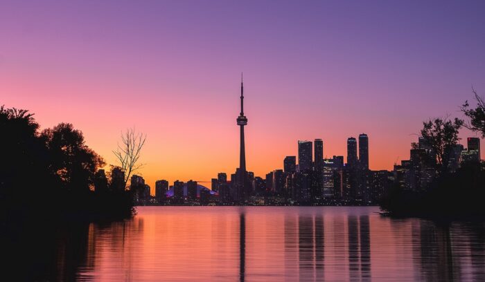 Toronto skyline at dusk, backdrop for discussions on Ontario's basic income pilot program