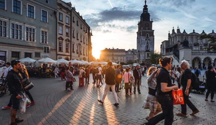 Tourists on Main Market Square in Krakow, for article on coal boiler replacement