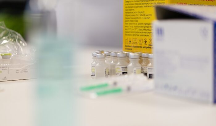 Vials and syringes in a lab, for article on not-for-profit drug access