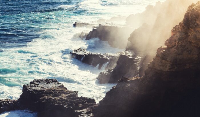 Ancient coastline with dramatic cliffs and ocean at dusk, for an article about human arrival Australia