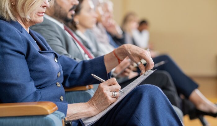Woman sitting and writing