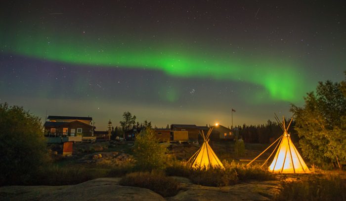 Teepees under the northern lights, for article on Indigenous-led conservation