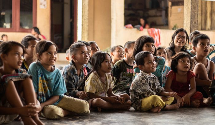 Indonesian children smiling, for article on Indonesia free meals program
