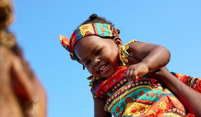 Holding a smiling baby