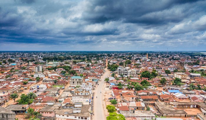 Solar panels installed in a rural West African setting for an article about Benin solar energy