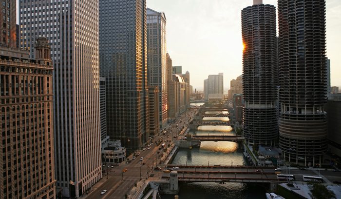 Kayakers paddling the calm urban waters of the Chicago River for an article about the Chicago River open-water swim