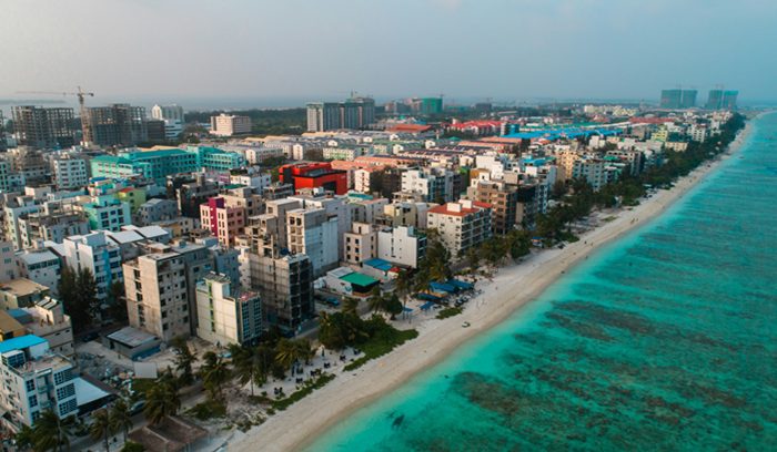 A Maldives island health clinic with a mother and newborn for an article about triple elimination mother-to-child transmission