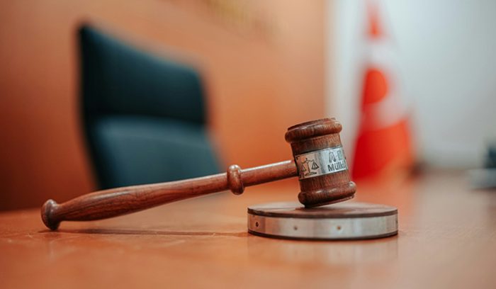 A gavel resting on a wooden surface for an article about date rape drugs as criminal weapons