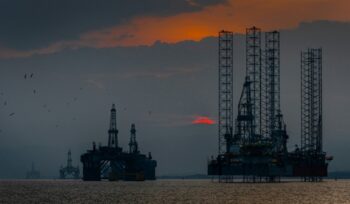 Offshore oil rigs at sunset