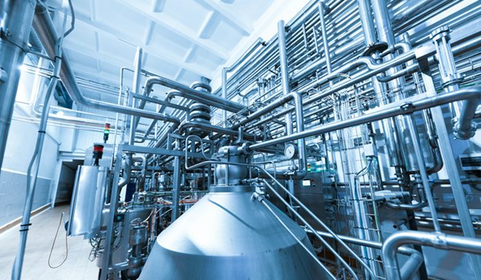 Industrial turbine machinery in a modern power facility for an article about supercritical CO2 power generation — 13 words.