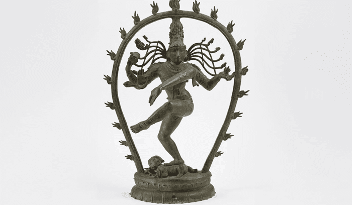 A bronze Nataraja sculpture on display in a museum, for an article about Smithsonian repatriation of Chola bronzes to India