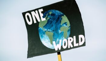 "One World" sign