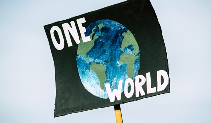 "One World" sign
