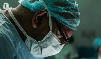 A community health clinic in a rural Mexican town with patients waiting outside, representing Mexico's universal healthcare launch under IMSS-Bienestar for an article about Mexico universal healthcare