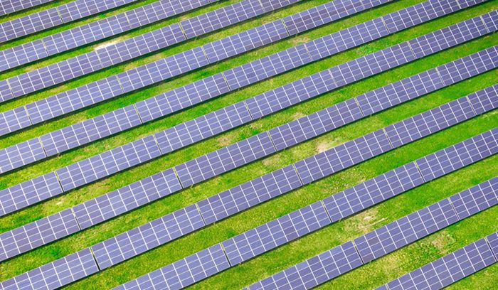 Aerial view of solar farm, for article on zero-carbon electricity grid