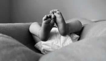 Baby in diaper, for article on California free diaper program