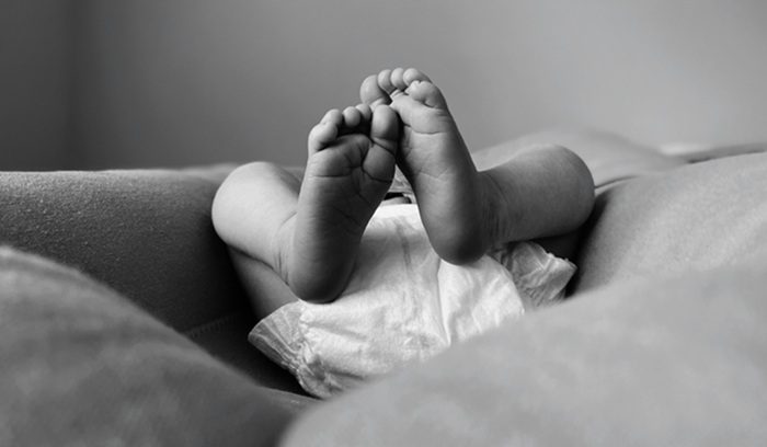 Baby in diaper, for article on California free diaper program