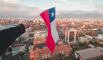 Someone holding a Chilean flag, for article on leprosy elimination