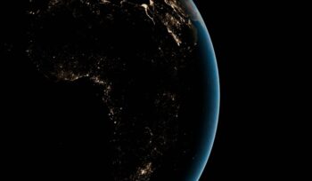 Satellite image of Africa at night with sparse lights, for article on Mission 300 electricity access