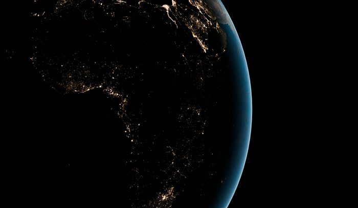Satellite image of Africa at night with sparse lights, for article on Mission 300 electricity access