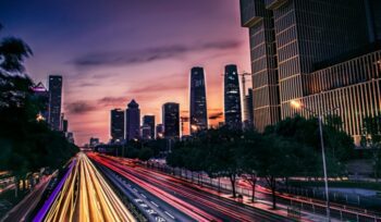 Beijing traffic lights at dusk, for article on EV health impact