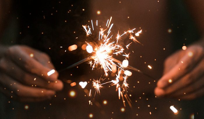 Sparks rising from a fire at night